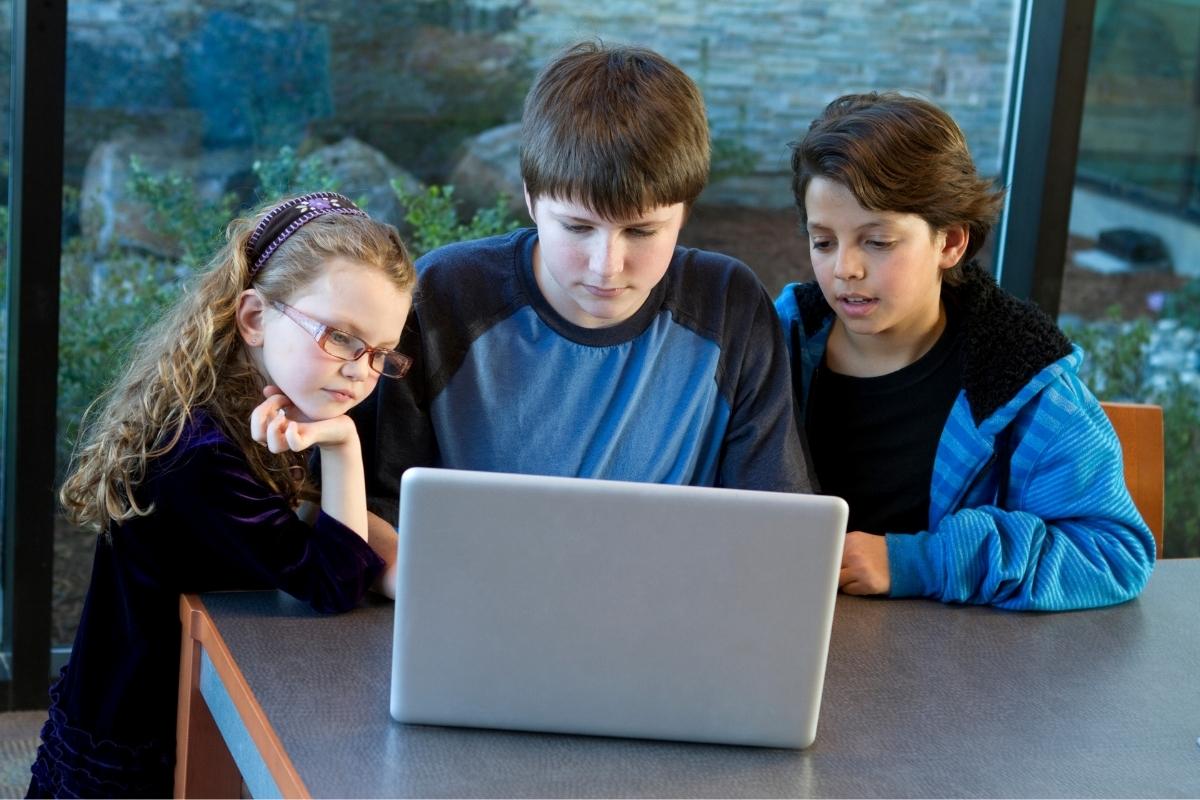 Parent reviewing RedNote social media app safety settings for their teen on a smartphone